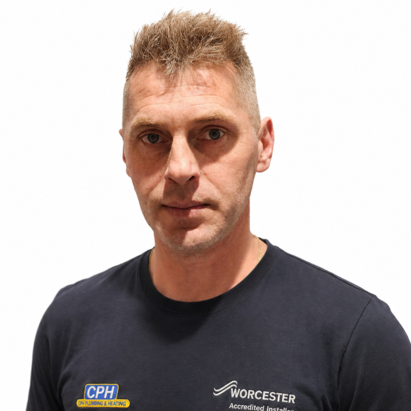 Tomasz from Croston Plumbing & Heating wearing company uniform against a light background
